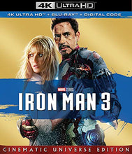 Load image into Gallery viewer, Iron Man 3 movie cover featuring Tony Stark in battle-damaged armor protecting Pepper Potts, with multiple Iron Man suits flying in the background.